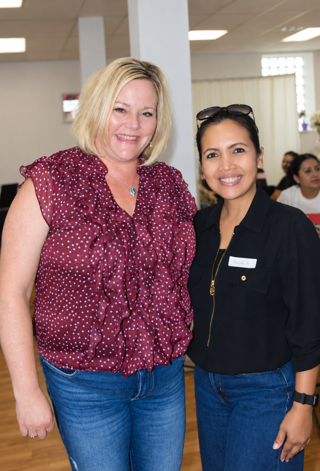 Two women smiling together at the reception